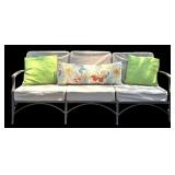 Outdoor Sofa with Tan Cushions and Decorative Pillows