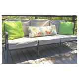 Outdoor Sofa with Tan Cushions and Decorative Pillows