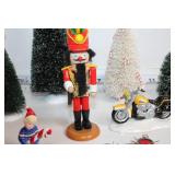 Collection of Holiday Decorations Including Nutcracker, Trees, and Ornaments