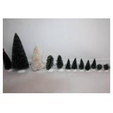 Collection of Holiday Decorations Including Nutcracker, Trees, and Ornaments