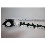 Collection of Holiday Decorations Including Nutcracker, Trees, and Ornaments