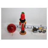 Collection of Holiday Decorations Including Nutcracker, Trees, and Ornaments