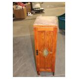 Black Leather Handbag with Intricate Silver Accent & Vintage Wooden Cabinet