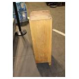 Black Leather Handbag with Intricate Silver Accent & Vintage Wooden Cabinet