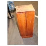 Black Leather Handbag with Intricate Silver Accent & Vintage Wooden Cabinet