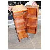 Black Leather Handbag with Intricate Silver Accent & Vintage Wooden Cabinet