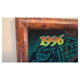 Framed slot machine glass