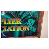 Framed slot machine glass