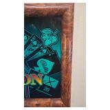 Framed slot machine glass