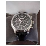 Invicta watch New in box and watch case for displaying watches.