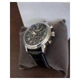 Invicta watch New in box and watch case for displaying watches.