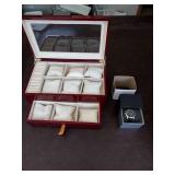 Invicta watch New in box and watch case for displaying watches.