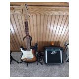 Vintage Johnson by AXL electric guitar with Peavey Rage 108 Amplifier and guitar stand.