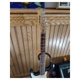 Vintage Johnson by AXL electric guitar with Peavey Rage 108 Amplifier and guitar stand.