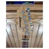 Vintage Johnson by AXL electric guitar with Peavey Rage 108 Amplifier and guitar stand.