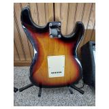 Vintage Johnson by AXL electric guitar with Peavey Rage 108 Amplifier and guitar stand.