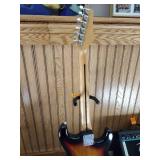 Vintage Johnson by AXL electric guitar with Peavey Rage 108 Amplifier and guitar stand.