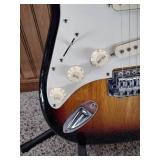 Vintage Johnson by AXL electric guitar with Peavey Rage 108 Amplifier and guitar stand.