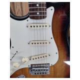 Vintage Johnson by AXL electric guitar with Peavey Rage 108 Amplifier and guitar stand.