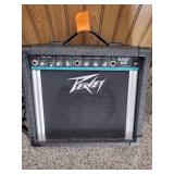 Vintage Johnson by AXL electric guitar with Peavey Rage 108 Amplifier and guitar stand.