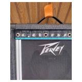 Vintage Johnson by AXL electric guitar with Peavey Rage 108 Amplifier and guitar stand.