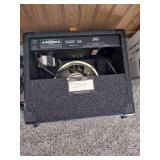 Vintage Johnson by AXL electric guitar with Peavey Rage 108 Amplifier and guitar stand.