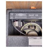 Vintage Johnson by AXL electric guitar with Peavey Rage 108 Amplifier and guitar stand.