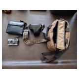Bushnell binoculars, Olympus 35 RC camera, minolta x-700 camera with bag