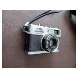 Bushnell binoculars, Olympus 35 RC camera, minolta x-700 camera with bag