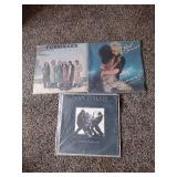 3 records: Foreigner, Rod Stewart, and Van Halen