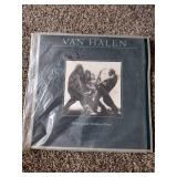 3 records: Foreigner, Rod Stewart, and Van Halen