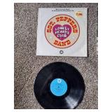 2 records: SGT peppers lonely hearts club, and beetles hey Jude