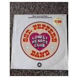 2 records: SGT peppers lonely hearts club, and beetles hey Jude