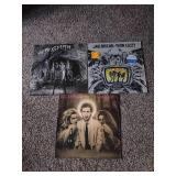 3 records: Aerosmith night in the ruts, jailbreak thin Lizzy, and Pete Townsend empty glass