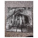 3 records: Aerosmith night in the ruts, jailbreak thin Lizzy, and Pete Townsend empty glass