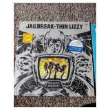 3 records: Aerosmith night in the ruts, jailbreak thin Lizzy, and Pete Townsend empty glass