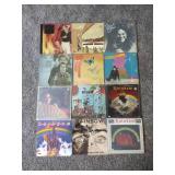 12 records: Simon & Garfunkel Bridge over Troubled Water, Jefferson Starship, Rainbow Rising, Tommy Bolin Private Eye,  Chaka Khan, Steve Wonder, Rainbow, Tommy Bolin