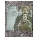 12 records: Simon & Garfunkel Bridge over Troubled Water, Jefferson Starship, Rainbow Rising, Tommy Bolin Private Eye,  Chaka Khan, Steve Wonder, Rainbow, Tommy Bolin