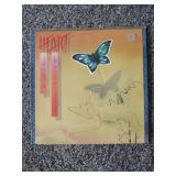 12 records: Simon & Garfunkel Bridge over Troubled Water, Jefferson Starship, Rainbow Rising, Tommy Bolin Private Eye,  Chaka Khan, Steve Wonder, Rainbow, Tommy Bolin