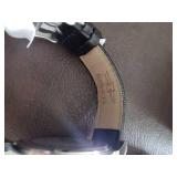 Invicta watch New in box and watch case for displaying watches.