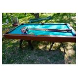 Regulation Pool Table With Set of Balls and Assorted Cue Sticks