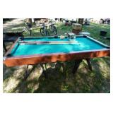 Regulation Pool Table With Set of Balls and Assorted Cue Sticks