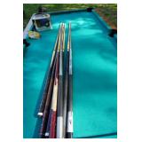 Regulation Pool Table With Set of Balls and Assorted Cue Sticks