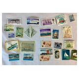 Collection of Themed International Stamps of Space, Airplanes, Flowers, Auto, Ships, Trains, Sports, Art and Costumes