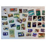 Collection of Themed International Stamps of Space, Airplanes, Flowers, Auto, Ships, Trains, Sports, Art and Costumes
