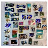Collection of Themed International Stamps of Space, Airplanes, Flowers, Auto, Ships, Trains, Sports, Art and Costumes