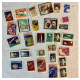 Collection of Themed International Stamps of Space, Airplanes, Flowers, Auto, Ships, Trains, Sports, Art and Costumes