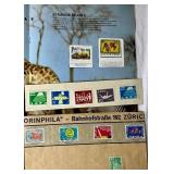 Bundle of Global Postage Stamps and 1982 USPS Stamp Album