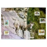 Bundle of Global Postage Stamps and 1982 USPS Stamp Album