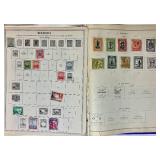 Bundle of Global Postage Stamps and 1982 USPS Stamp Album